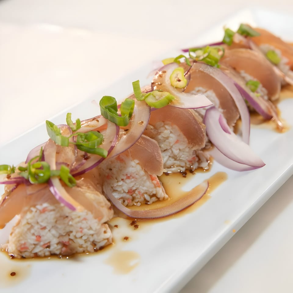 Jimmy's Poke & Sushi Burrito's poke dish with tuna, rice, red onions, and green onions.